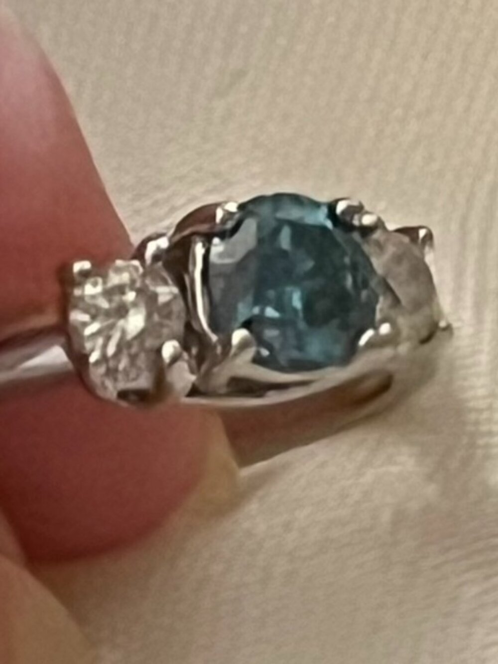 Blue natural diamond, white gold ring with accent diamonds